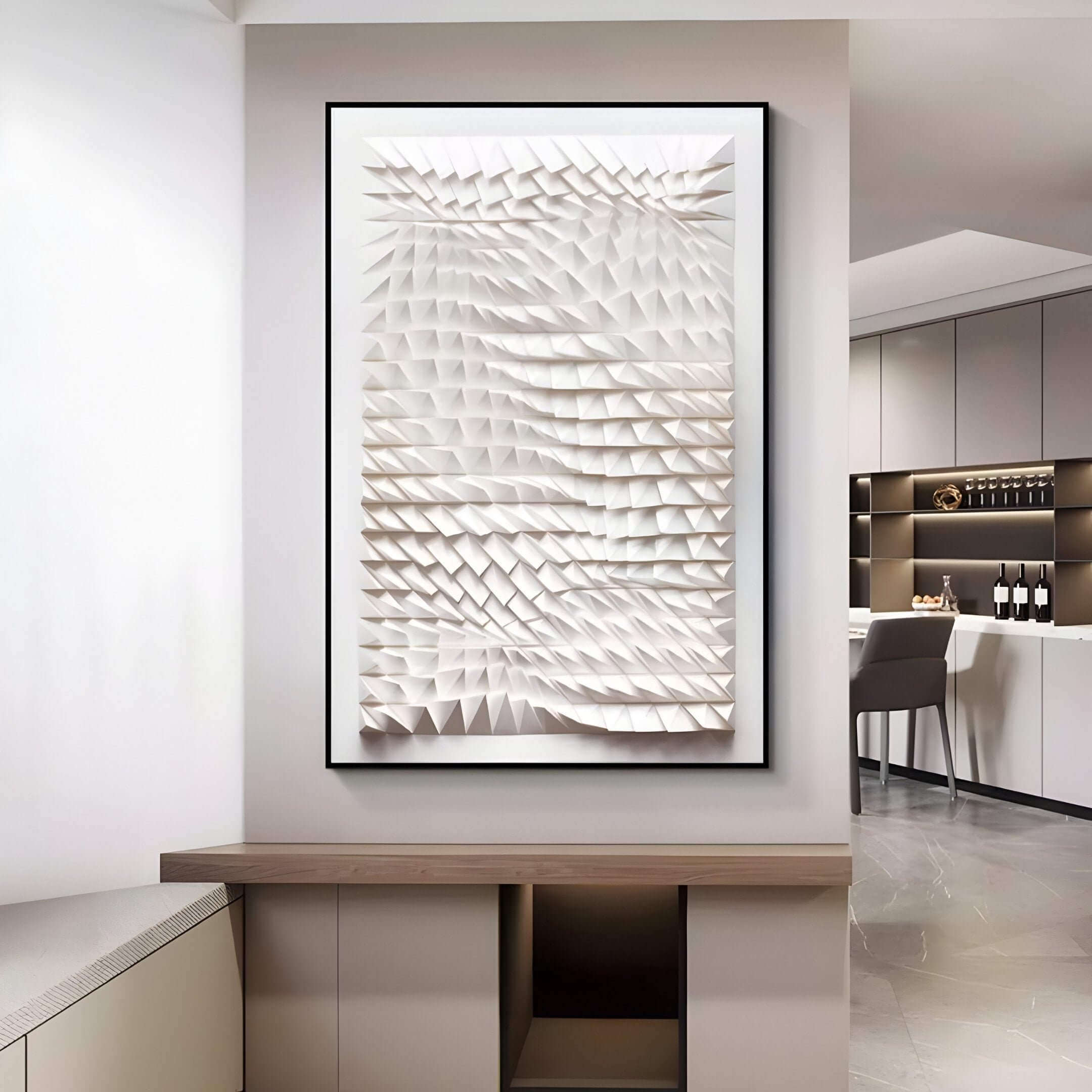 The Elorium White Wave Hand-Painted Wood Relief 3D Wall Art by Giant Sculptures, featuring geometrically textured triangular shapes, is a modern piece hanging on a stylish rooms wall. Its sleek décor includes cabinets, a chair, wine bottles, and soft lighting that enhances the artworks depth.