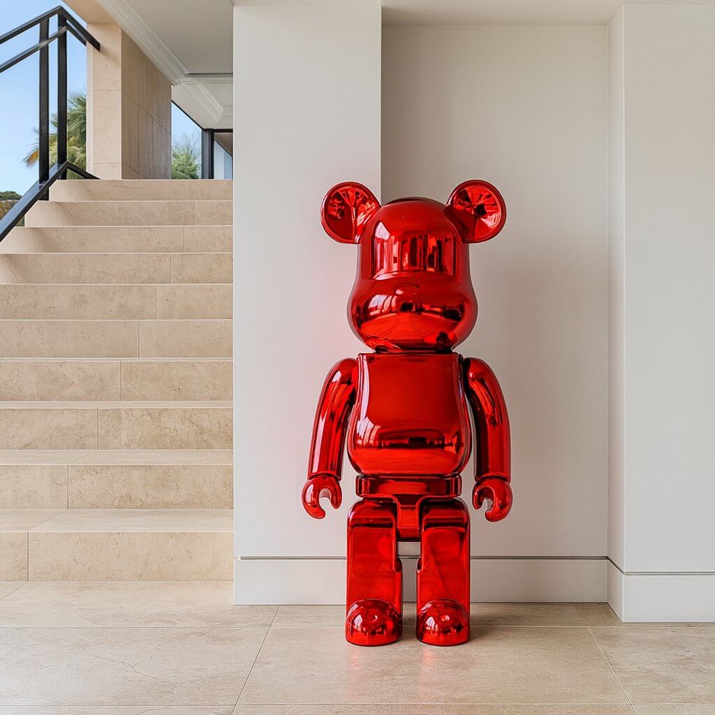 Ruby Red Bear Sculpture standing at 135cm in a modern hallway with beige stone flooring and white walls.