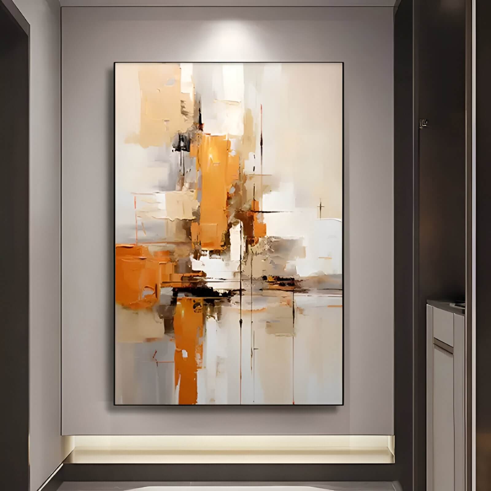 Abstract painting in warm orange, beige, white, and gray tones with layered brushstrokes and geometric shapes, displayed in a modern hallway with accent lighting.