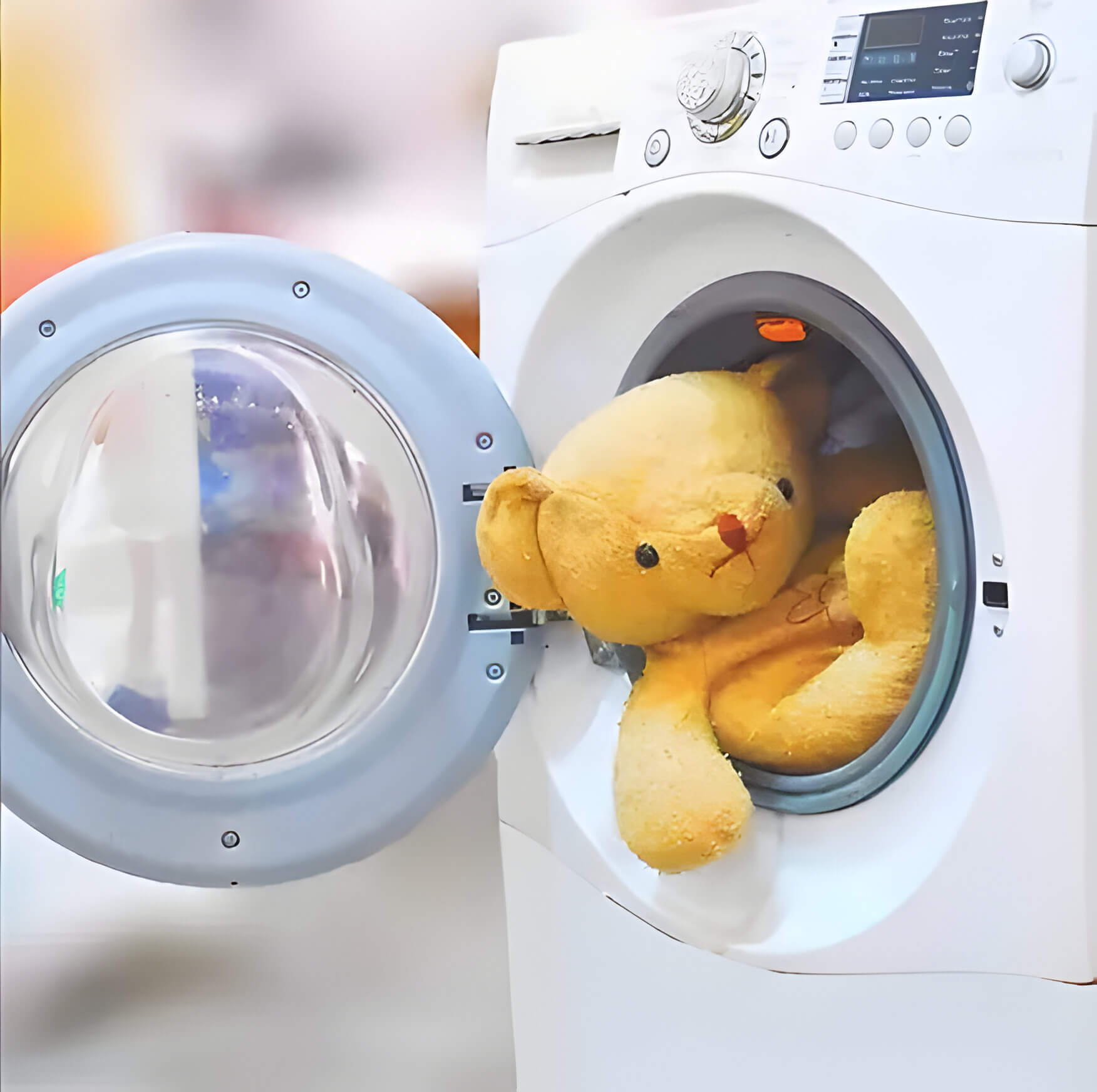 How to Clean Baby Toys: A teddy bear in a washing machine