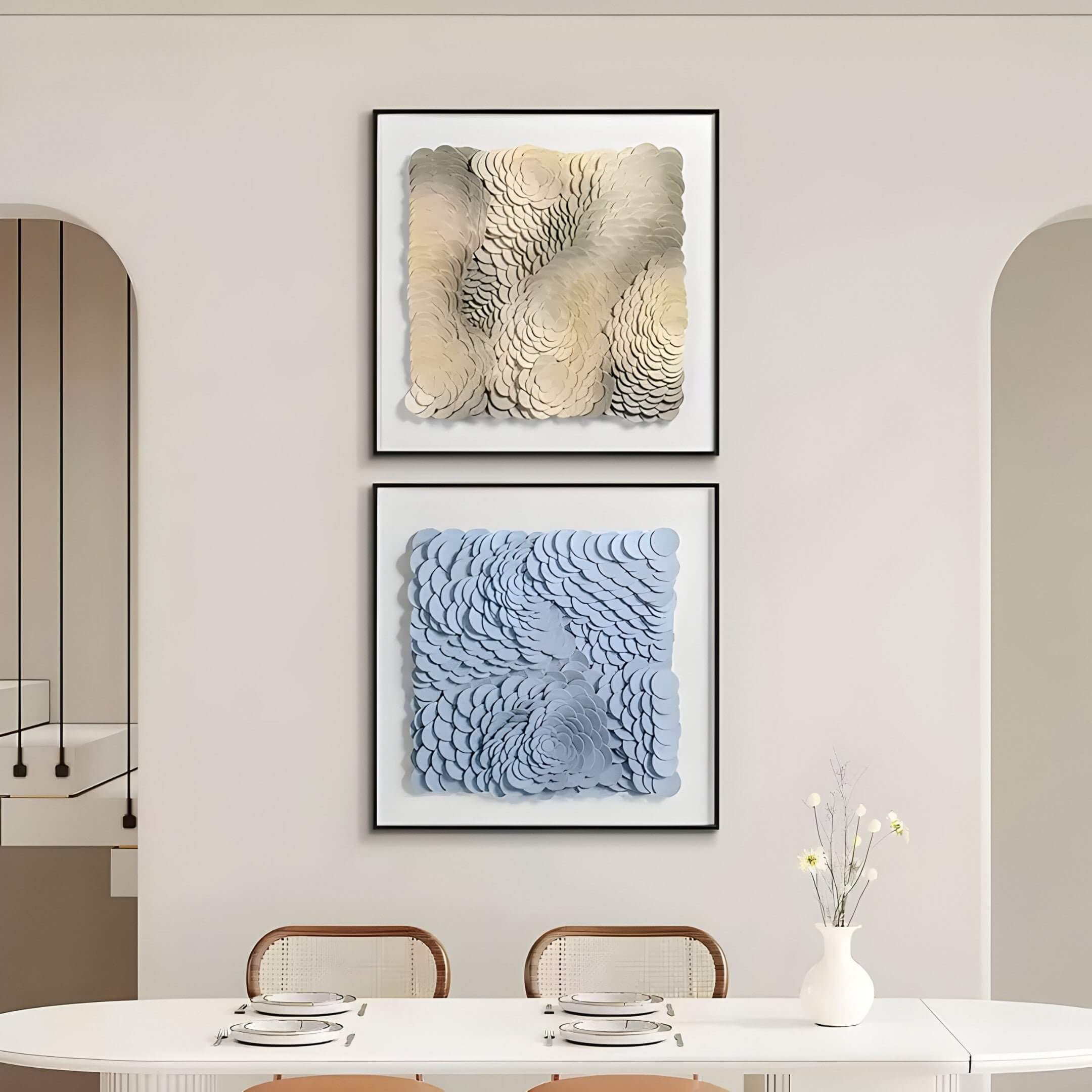 Sculptural blue leather 3D wall art featuring layered petal-like forms in a square frame, displayed in a modern dining room with curved-back chairs and minimal decor.