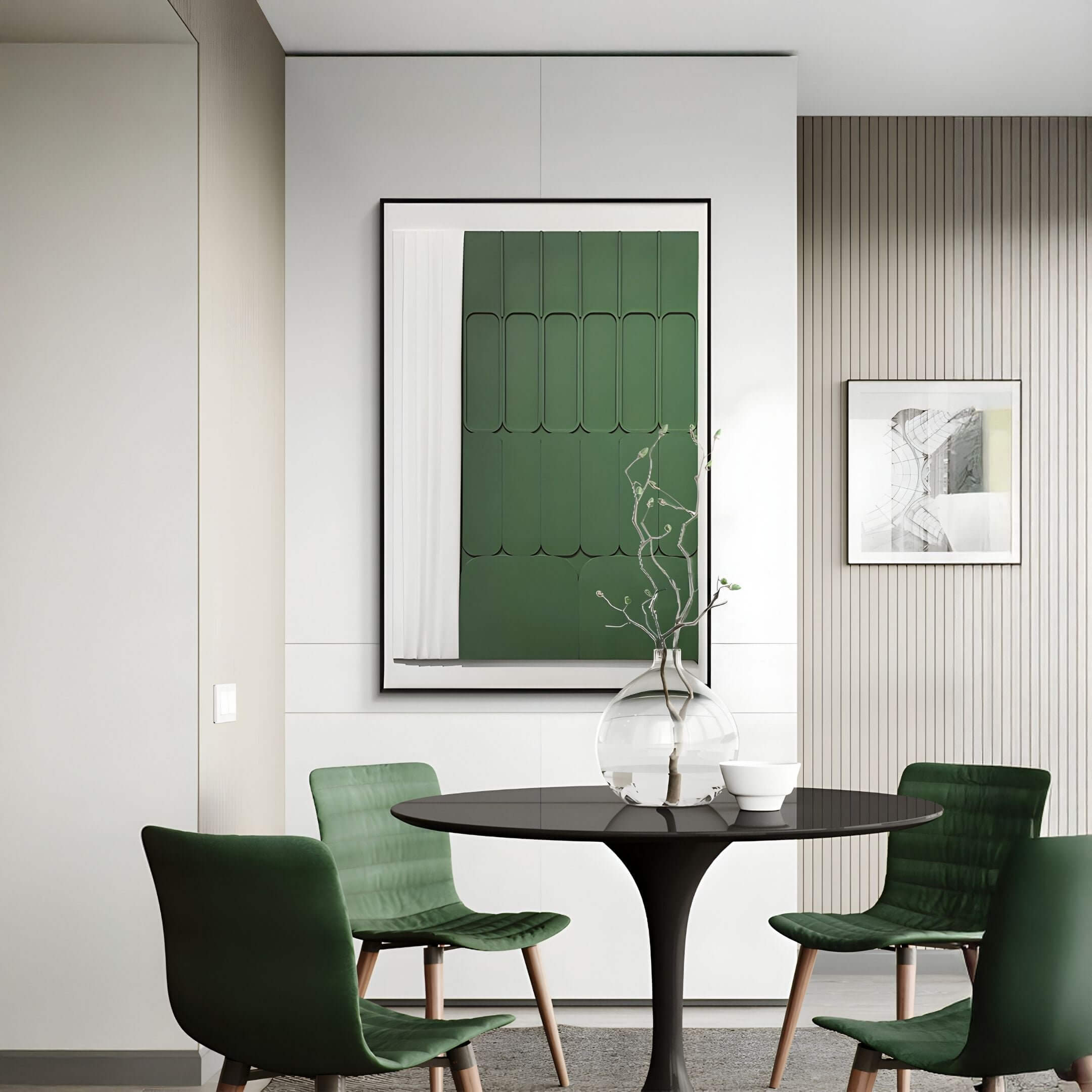 Vertical green and white 3D wall art featuring carved wood panel details in a geometric layout, displayed in a modern dining area with green chairs and a round black table.