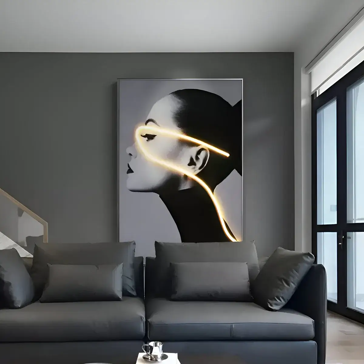 A dramatic black-and-white portrait of a woman, highlighted by a glowing neon light tracing her face, adding a futuristic touch to a dark-toned interior.