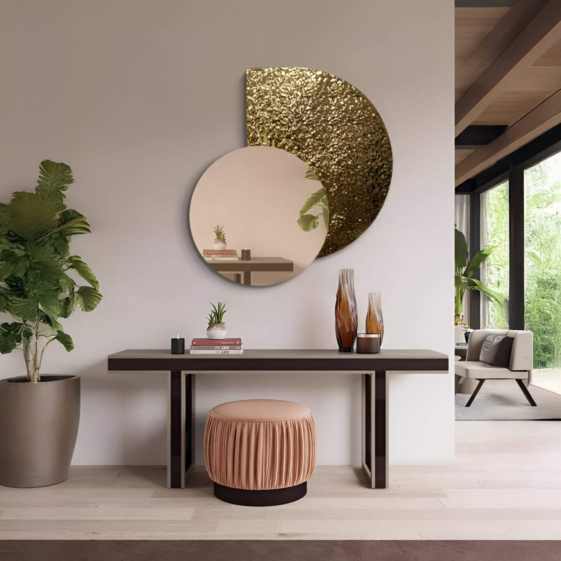 A modern hallway featuring a round mirror art piece with overlapping gold and reflective circular panels above a sleek console table, styled with vases and a velvet stool for a refined contemporary look.