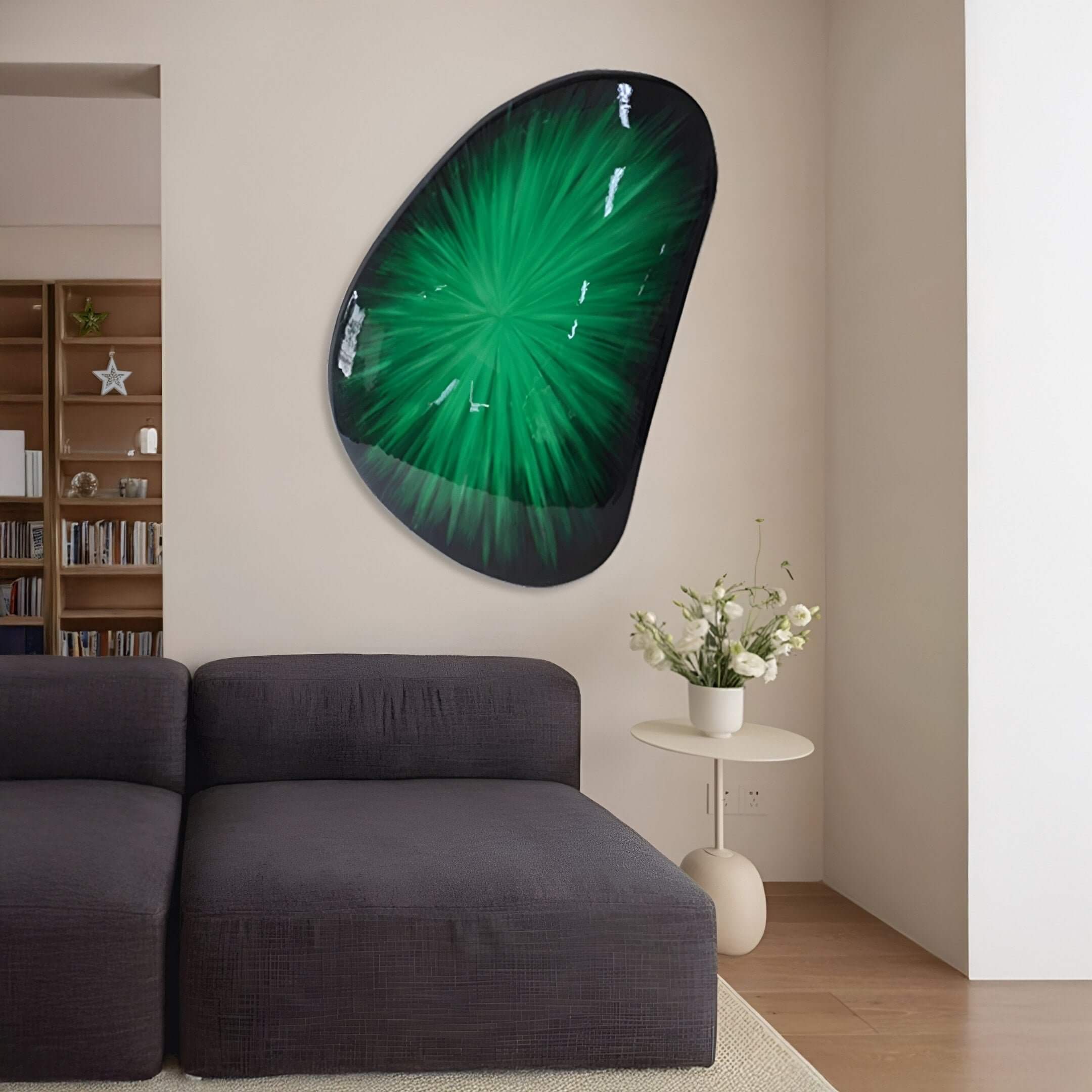 A modern living room featuring the Veyora Emerald Burst 3D Relief Wall Art, showcasing a radiant green abstract design with a sculptural surface, mounted above a dark sectional sofa and minimal decor.