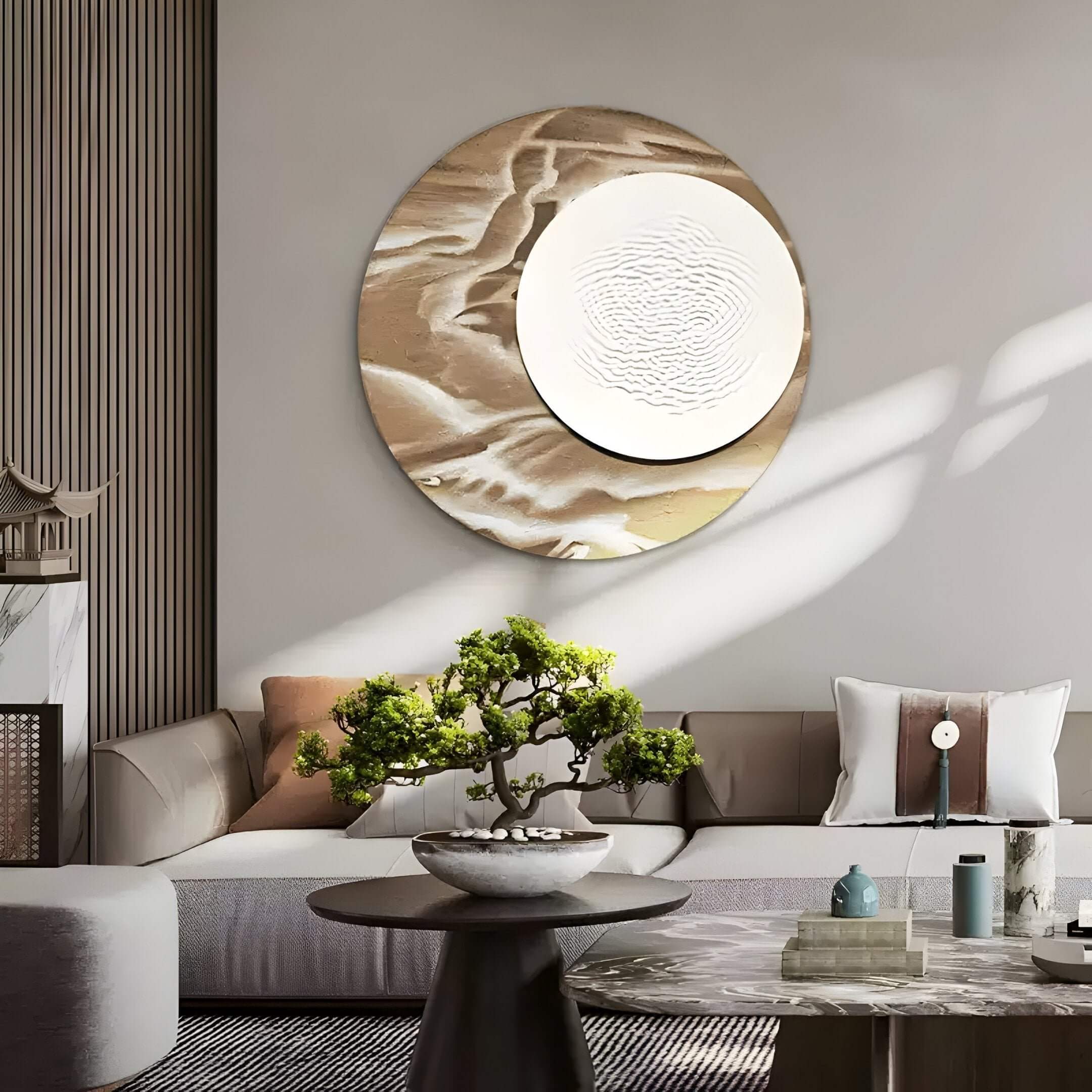 A modern living room with a beige sectional sofa, a Giant Sculptures Reveria Sandy Beige Abstract Wood Carving 3D Wall Art, a coffee table topped with a bonsai plant, and sunlight casting gentle shadows across the space.