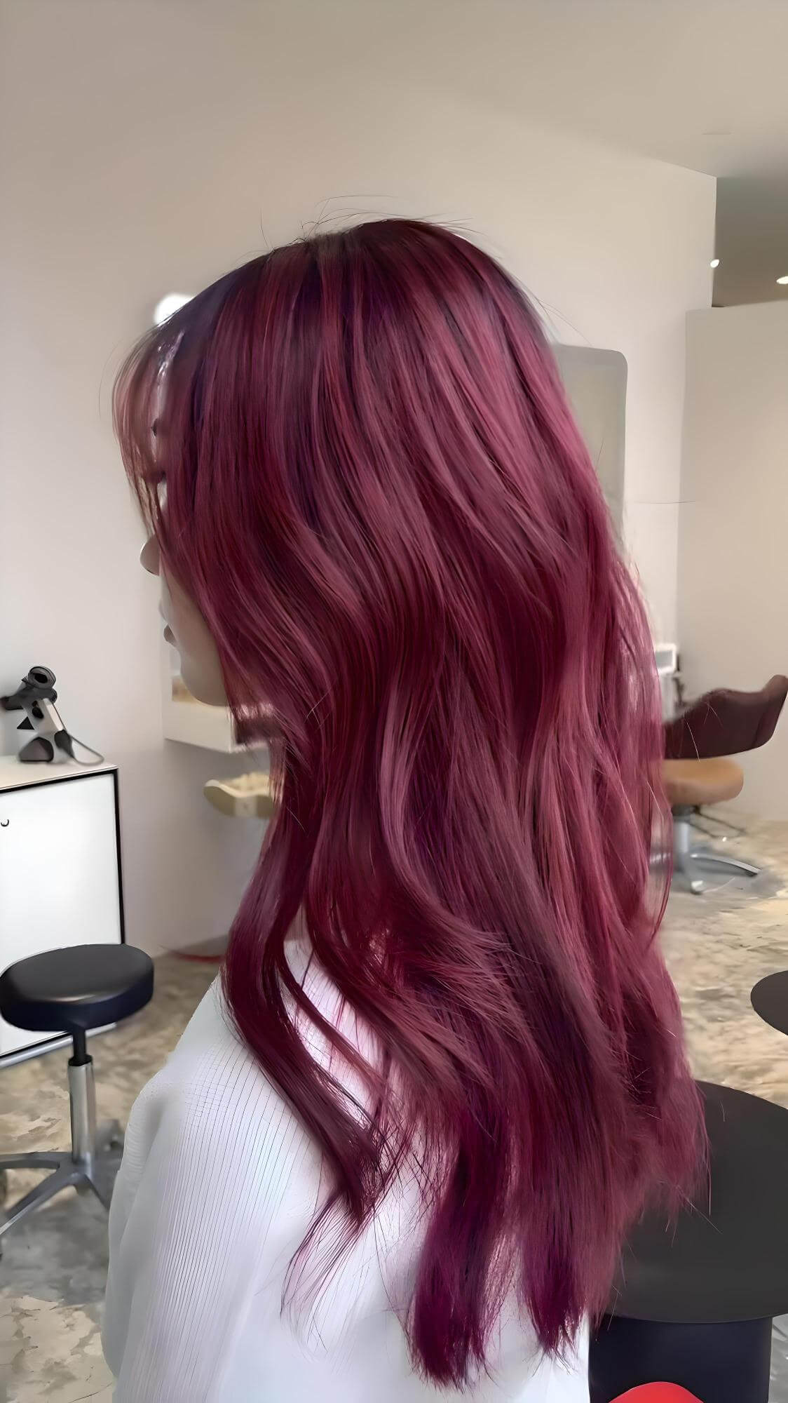 This bewitching vampy purplish red hair color is a captivating trend, promising to add a touch of sultriness and a youthful glow while remaining versatile and easy to maintain.