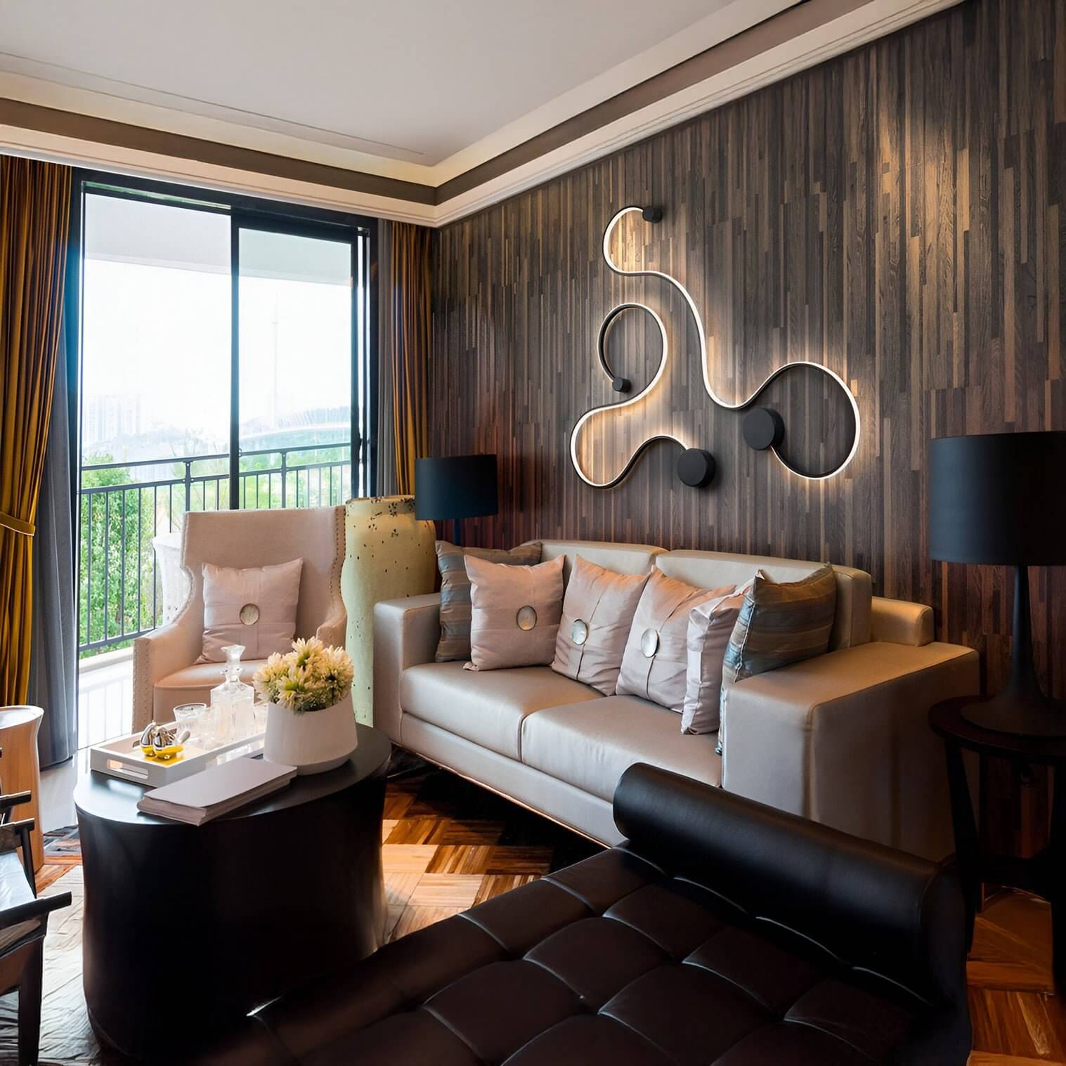 Organic-shaped LED wall fixture with black circular mounts on a wood-paneled living room wall above a cream sofa.