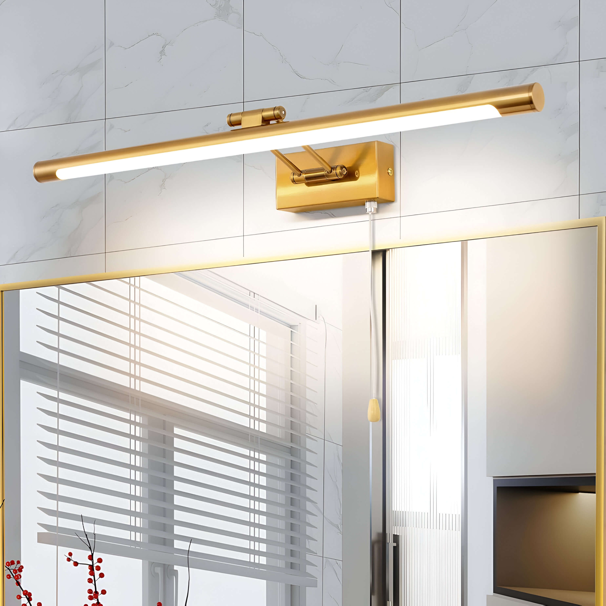 A modern gold picture light mounted above a bathroom mirror, providing warm and focused lighting. The background includes white tiled walls and sleek fixtures.