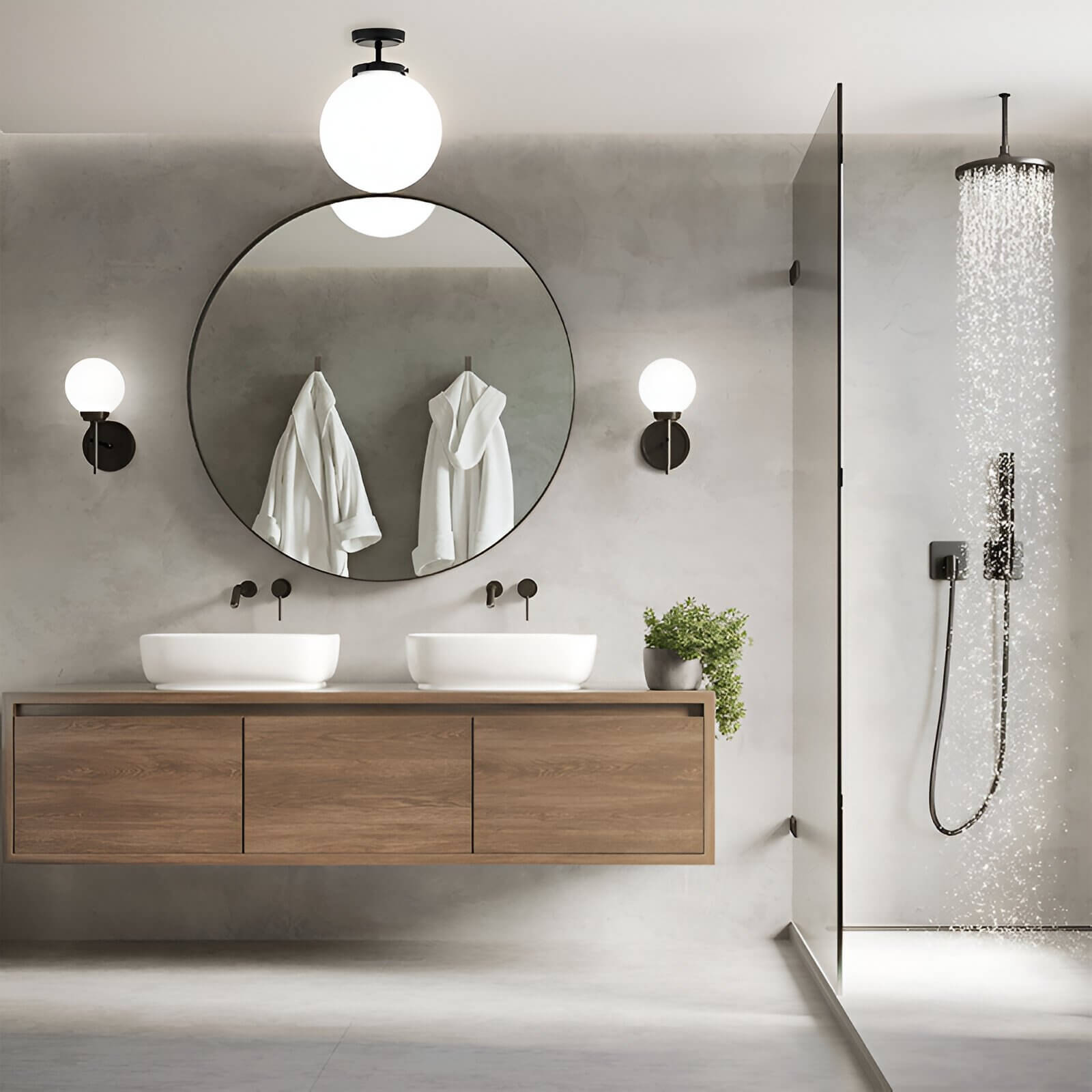 Minimalist bathroom with floating wood vanity, round mirror, and glass shower under bright, modern spherical lights.
