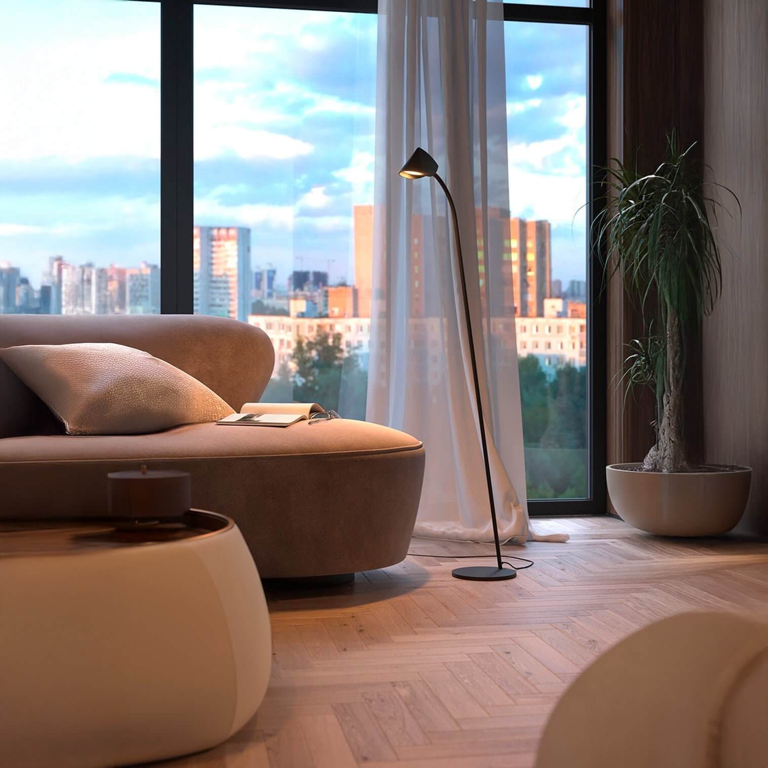 Sleek black floor lamp with angled cone shade beside a window and modern sofa.