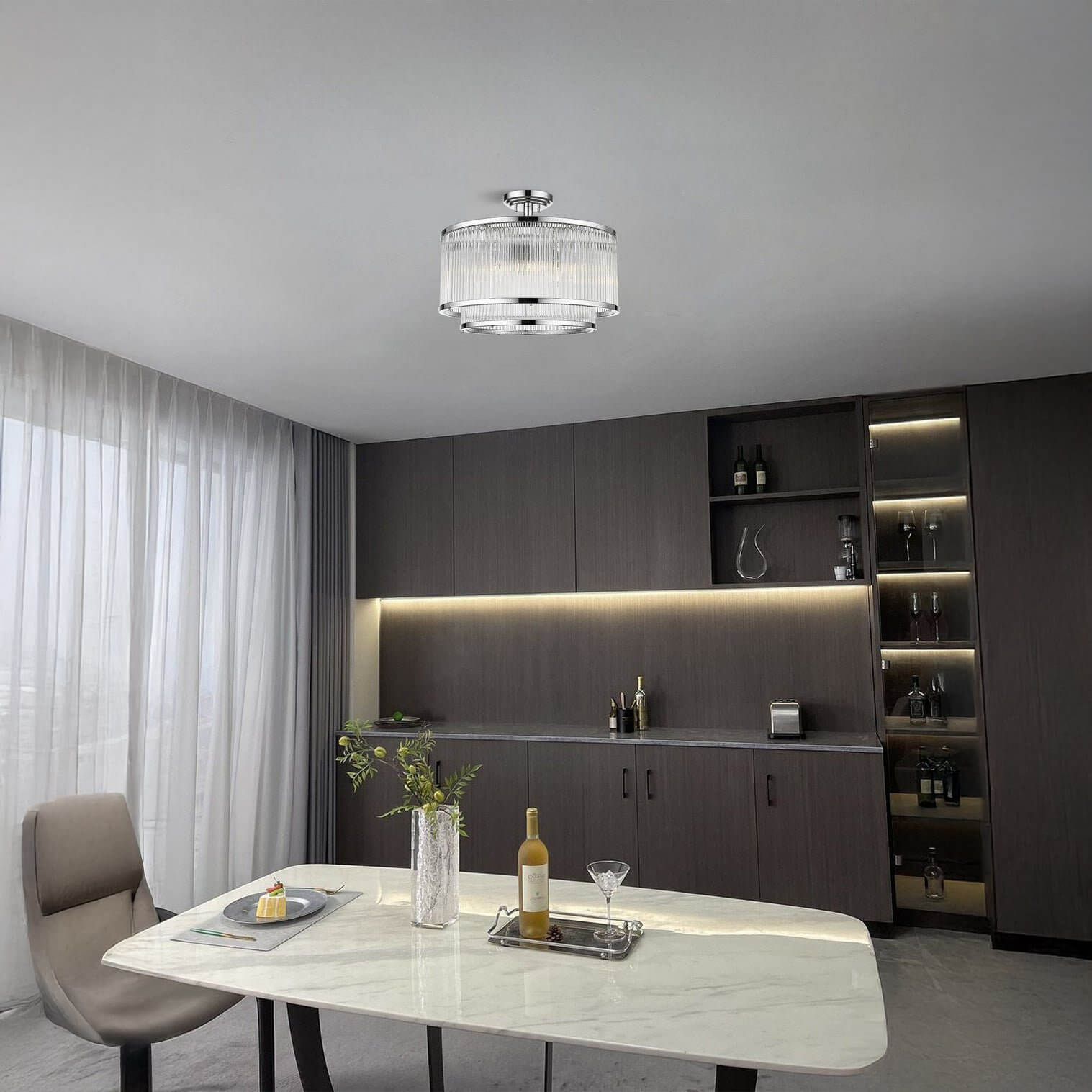 Compact crystal drum ceiling light in a sleek modern dining room with marble table.
