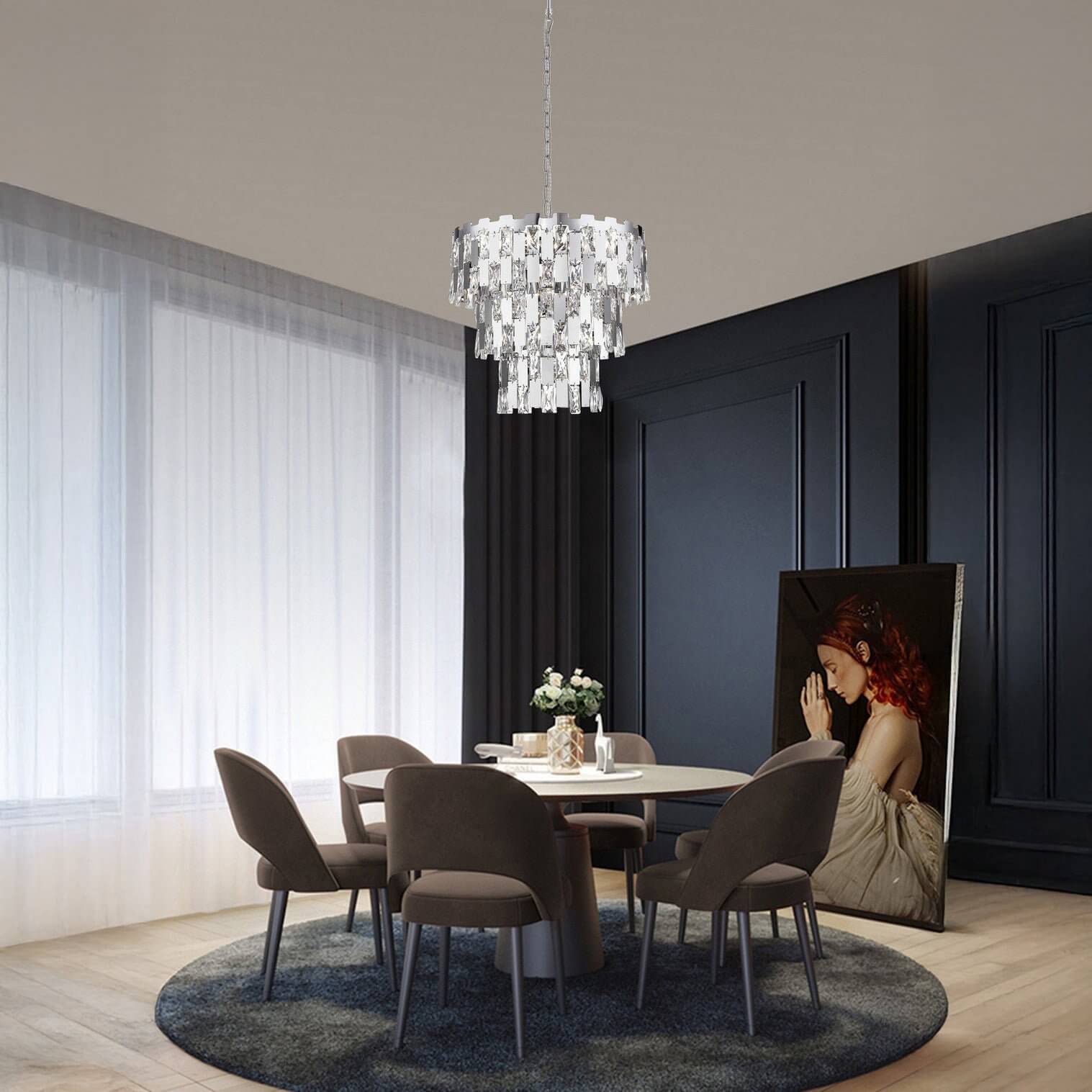 Tiered crystal chandelier with rectangular prisms hangs above a round dining table in a dark-paneled contemporary room.