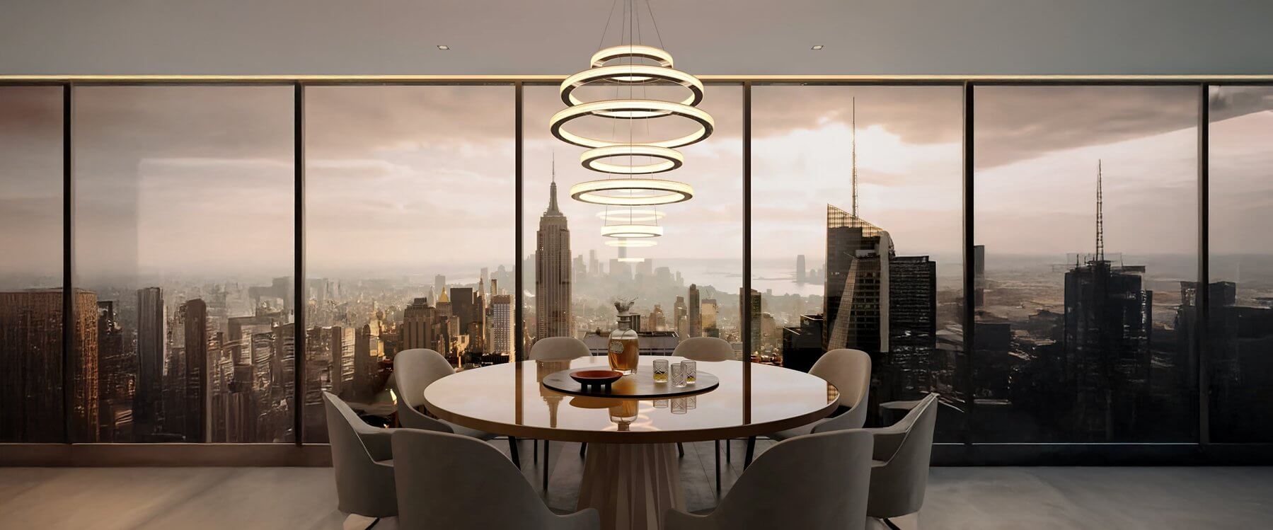 Modern dining room lights with a round wooden table, surrounded by contemporary chairs and a view of a city skyline through floor-to-ceiling windows. A multi-ring pendant light hangs above the table.