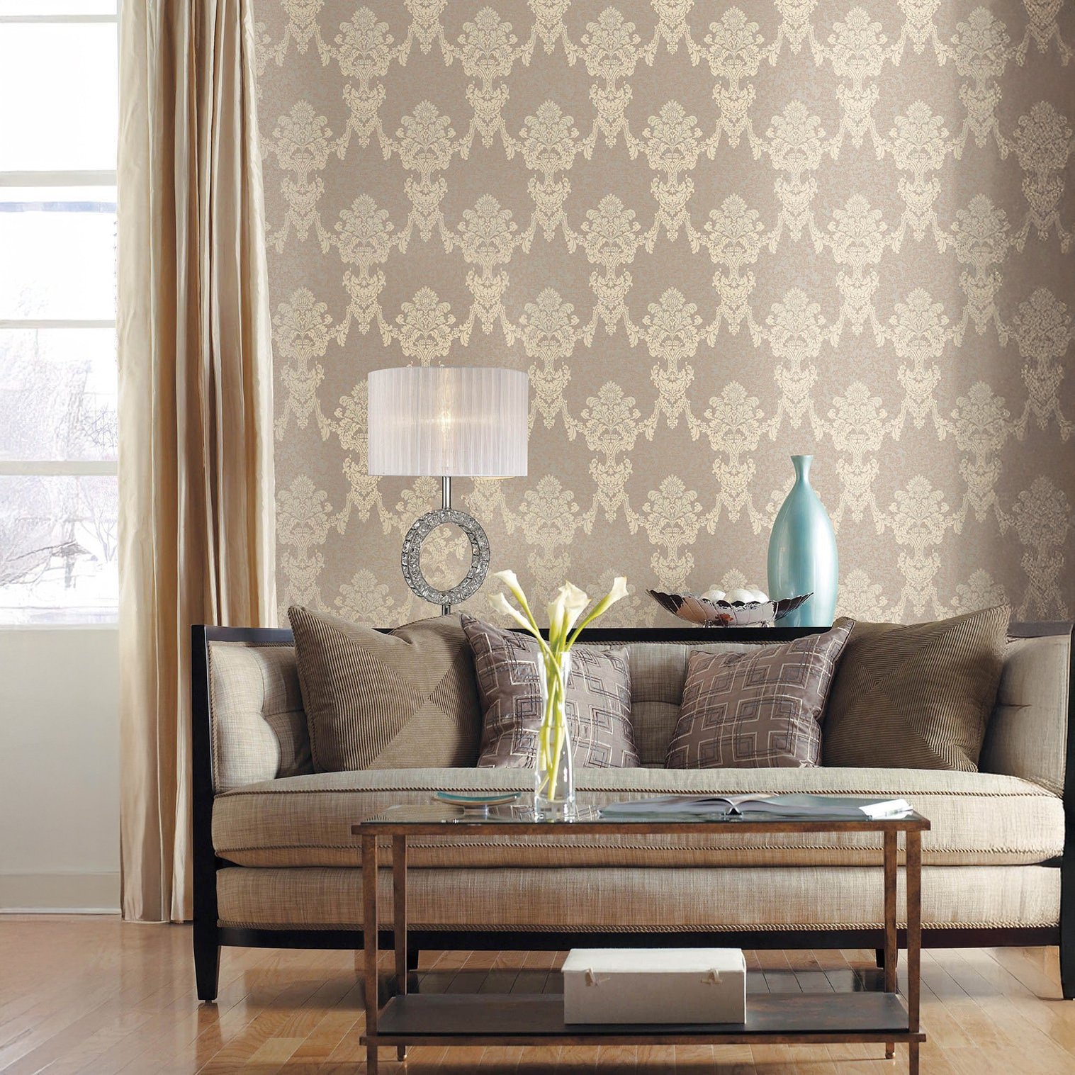 Elegant living room with patterned wallpaper and a crystal-accented table lamp by the sofa.
