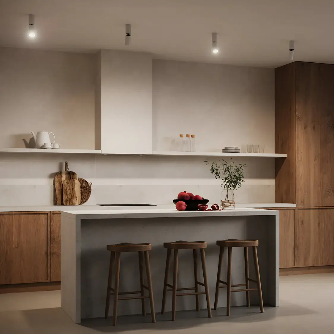 A warm minimalist kitchen featuring natural wood cabinetry and a concrete island. Modern white ceiling-mounted lights provide ambient illumination, while red apples and greenery add a pop of colour.