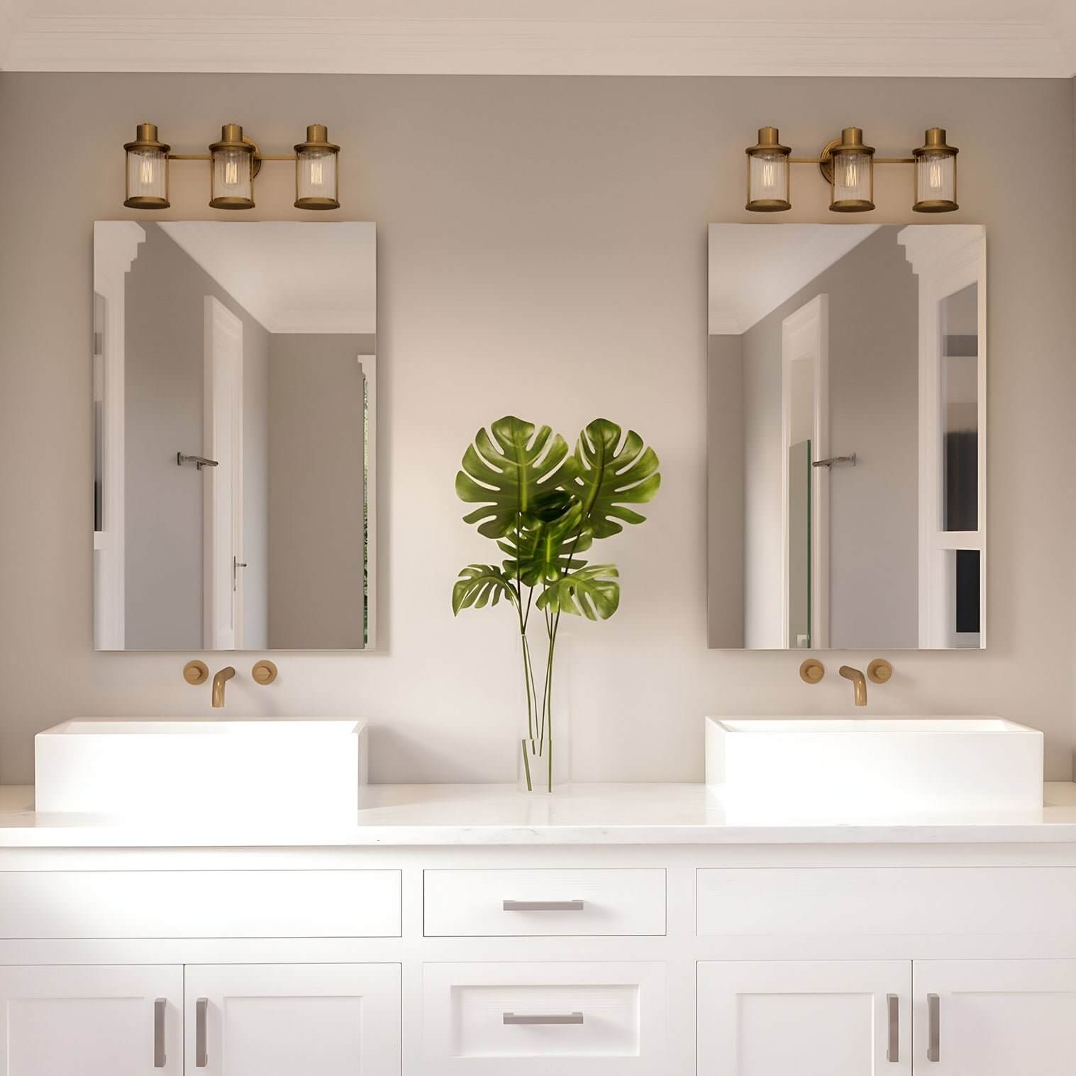 Double vanity with white cabinets, two mirrors, and three-light industrial-style fixtures with brass finishes above each mirror.