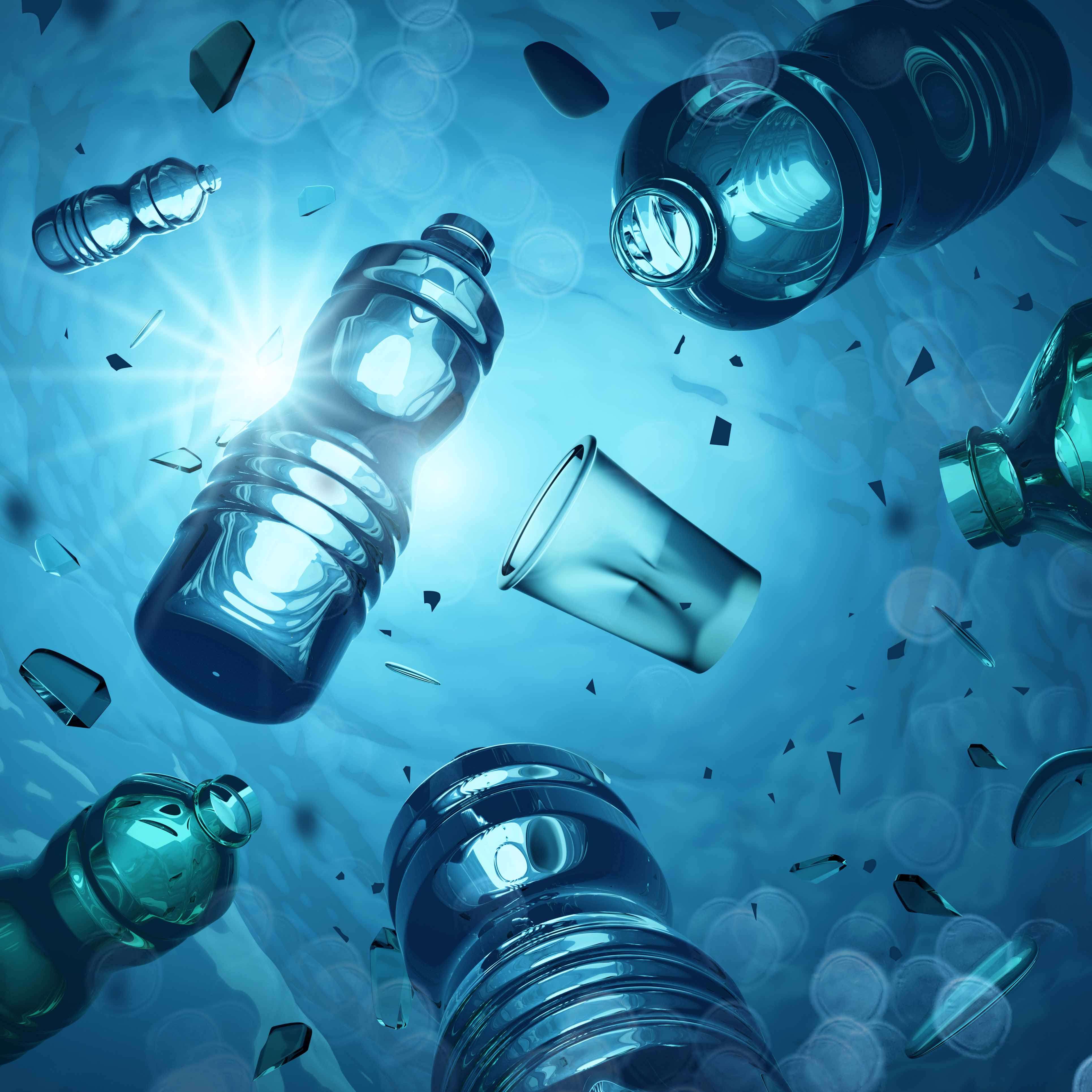 Plastic bottles and debris floating underwater, symbolizing microplastic pollution and synthetic waste.