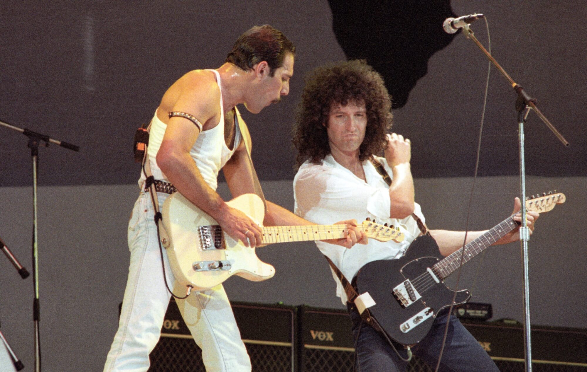 Freddie Mercury and Brian May of Queen performing live on stage