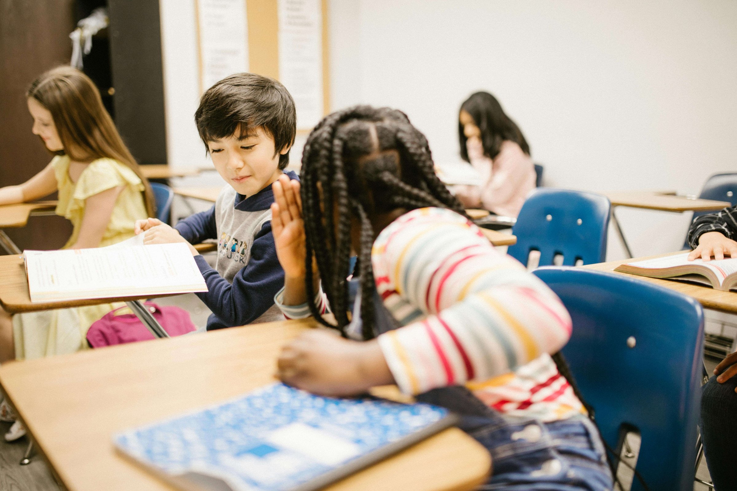 Students collaborating in a row classroom layout