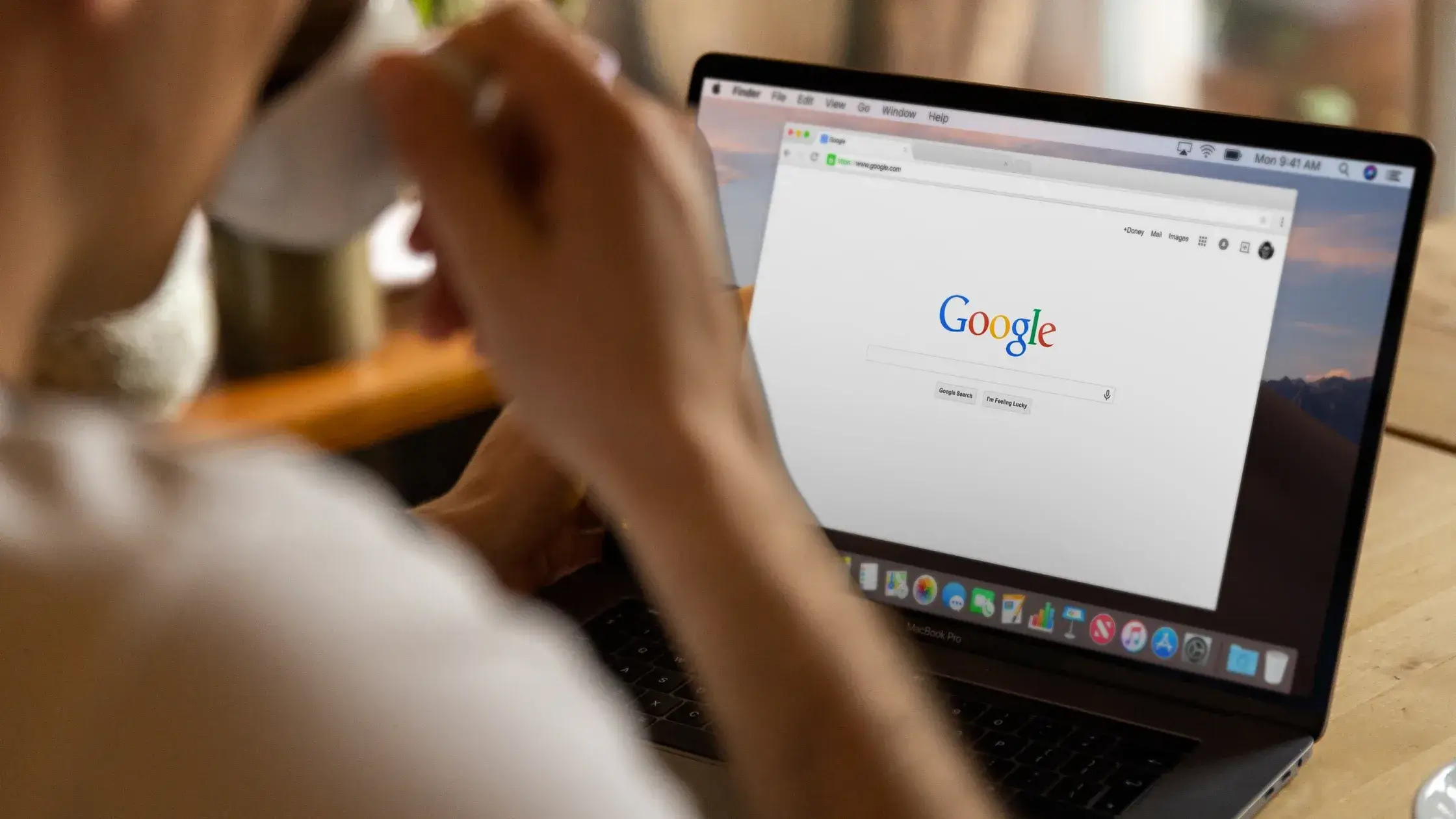 Person using Google Search on a laptop. Could be related to Google Project Management Certification research.