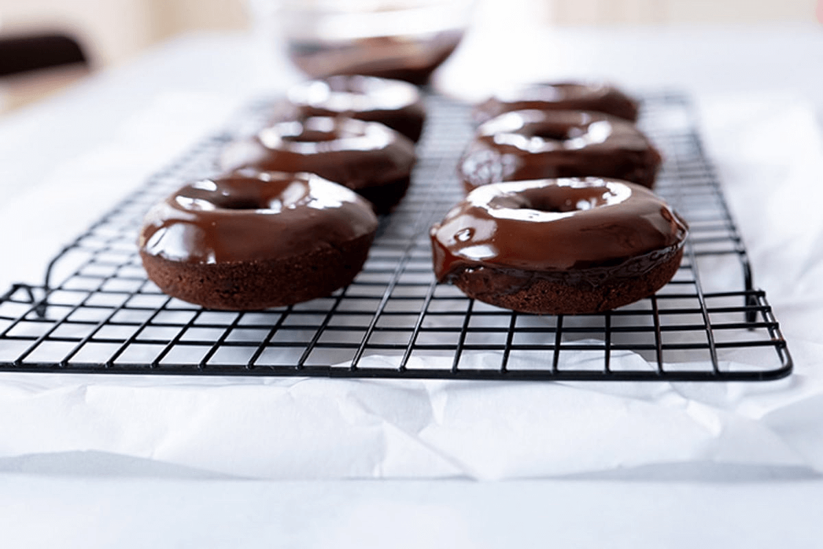 Finished Healthy Chocolate Donuts on a cooling rack.