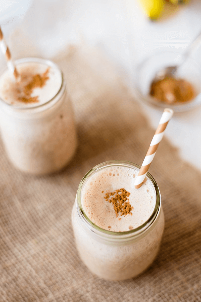 A photo of 2 individual and plated Chocolate Peanut Butter Shake in cups.