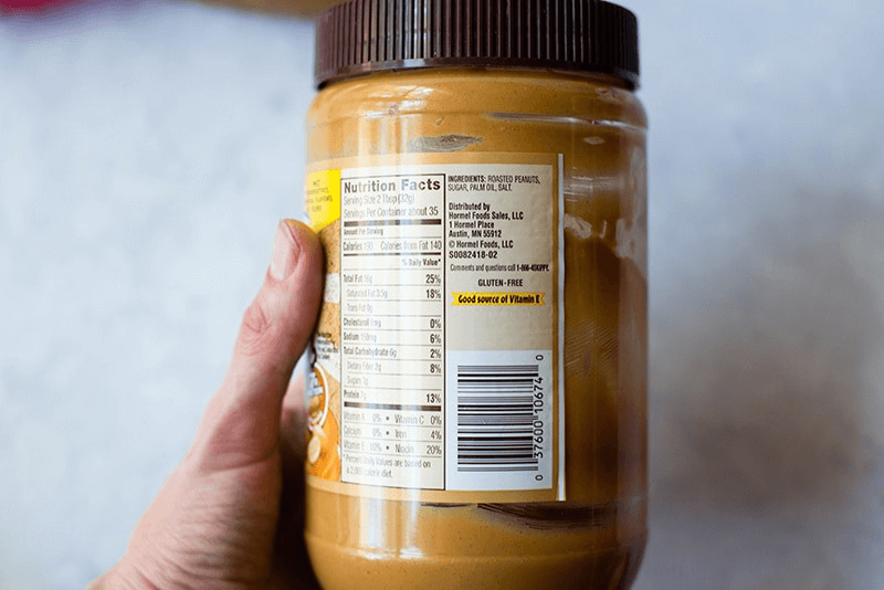 A photo of a peanut butter container showing the nutrition label.