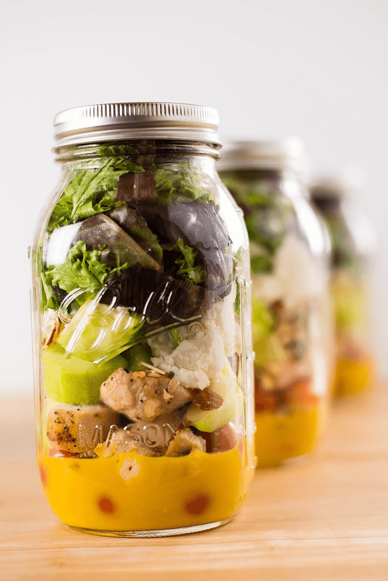 Prepped mason jar salad ready to store.