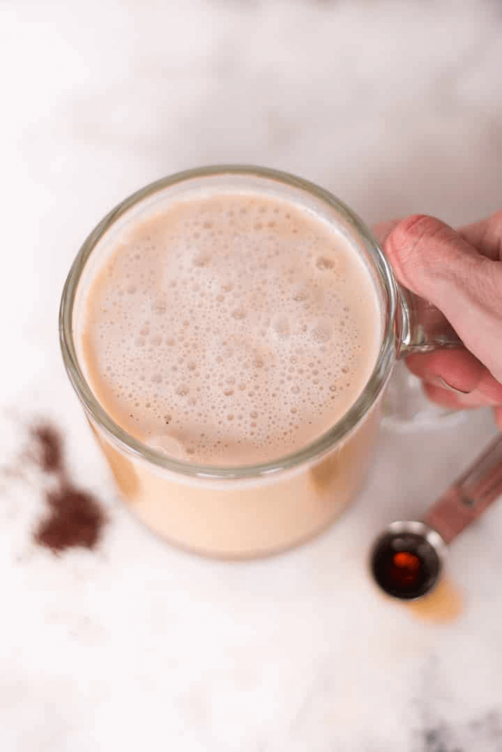 A photo of a clear glass mug full of a Healthy Vanilla Latte Recipe.