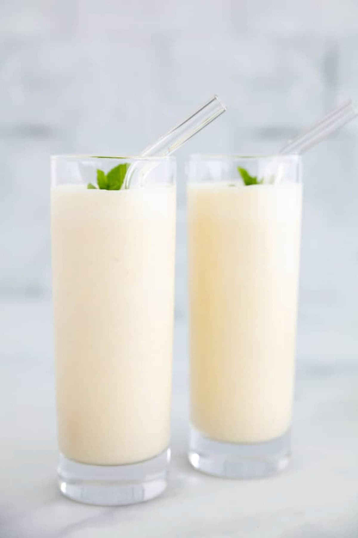 A photo of a finished and plated peach protein shake.