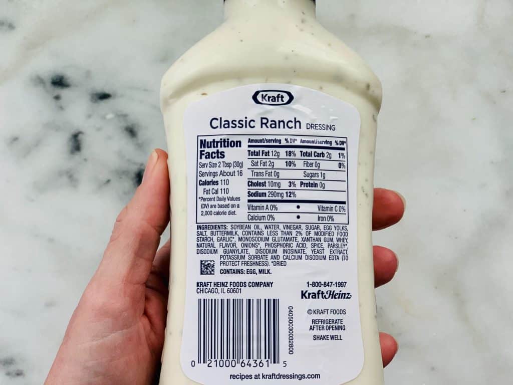 Overhead view of the label of a bottle of salad dressing which contains MSG, one of the 10 Foods That Cause Inflammation.
