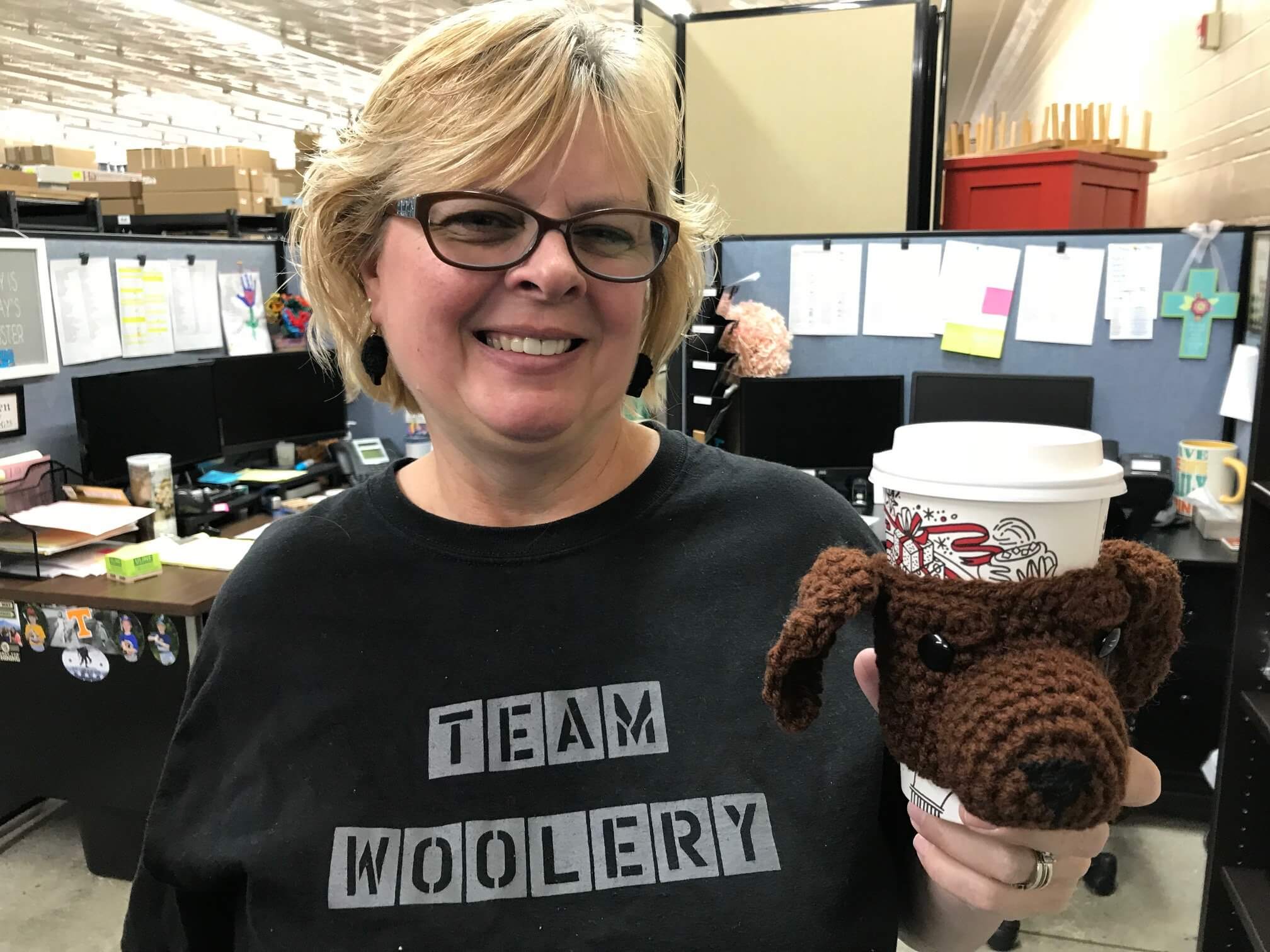 Debbie with her crochet dog cup cozy