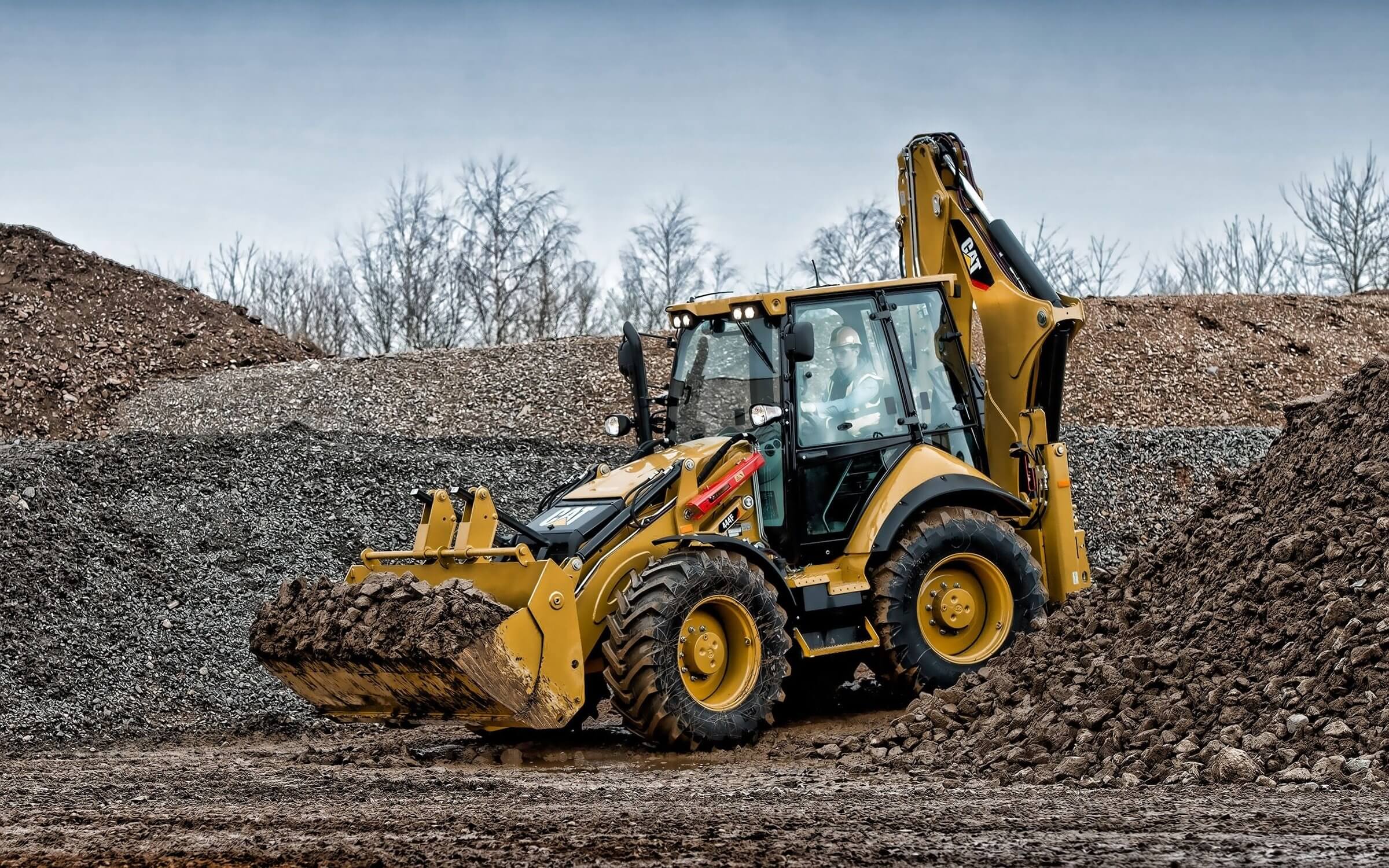 Standard backhoe loader (with a broad price range beneficial to review).