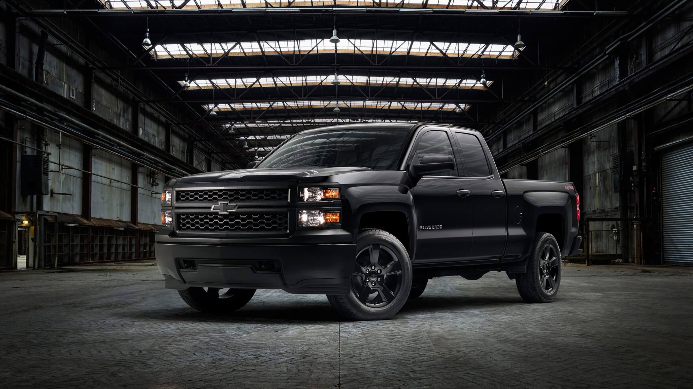 Black Chevy pickup truck, with advanced safety features, enhanced cargo capacity, and crew cab, perfect for truck enthusiasts