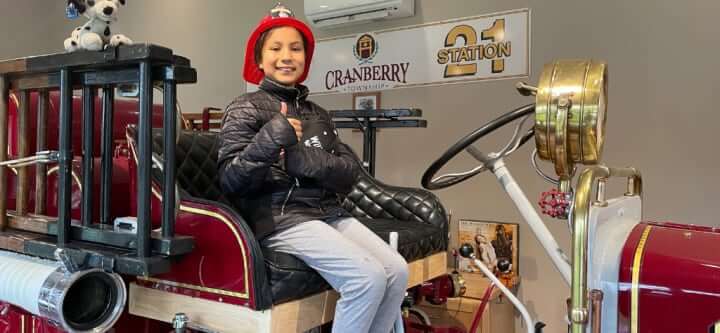 Tatiana Johnson on a fire truck