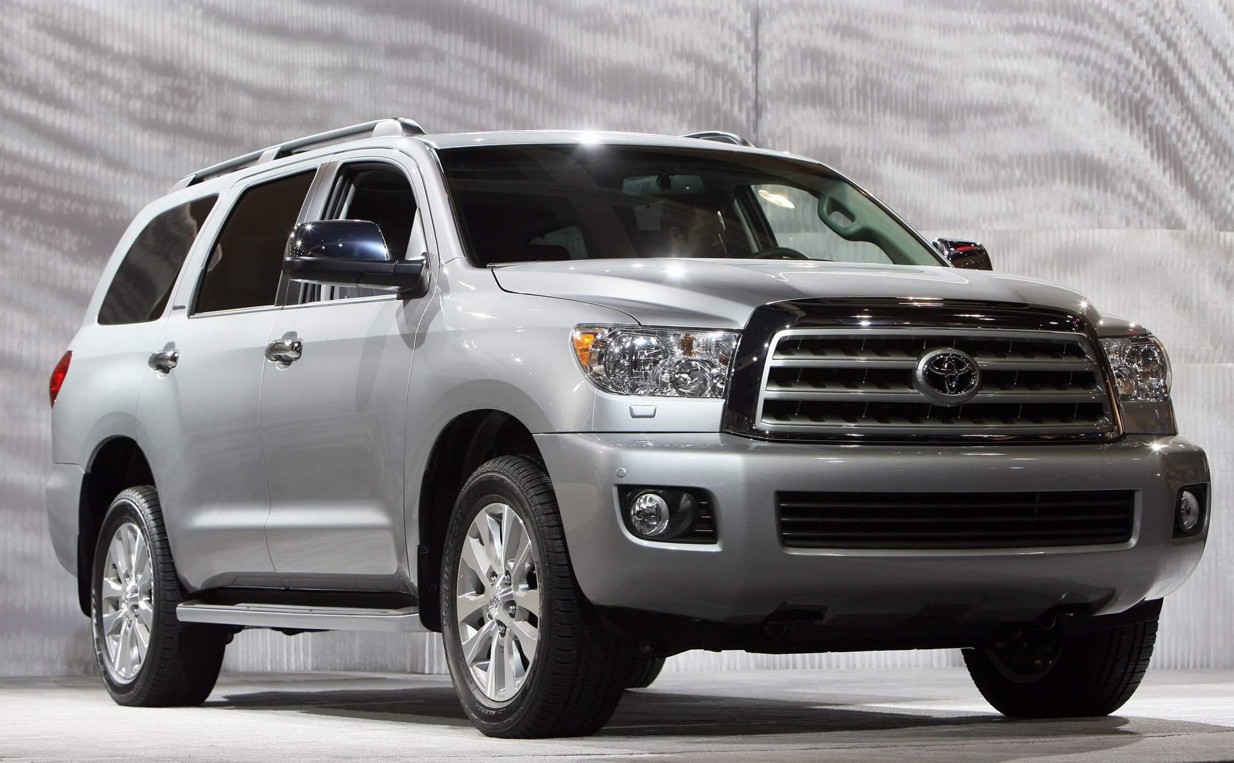 Best SUVs for towing- White Toyota Sequoia, full size SUV, available with four wheel drive, providing off road capability.