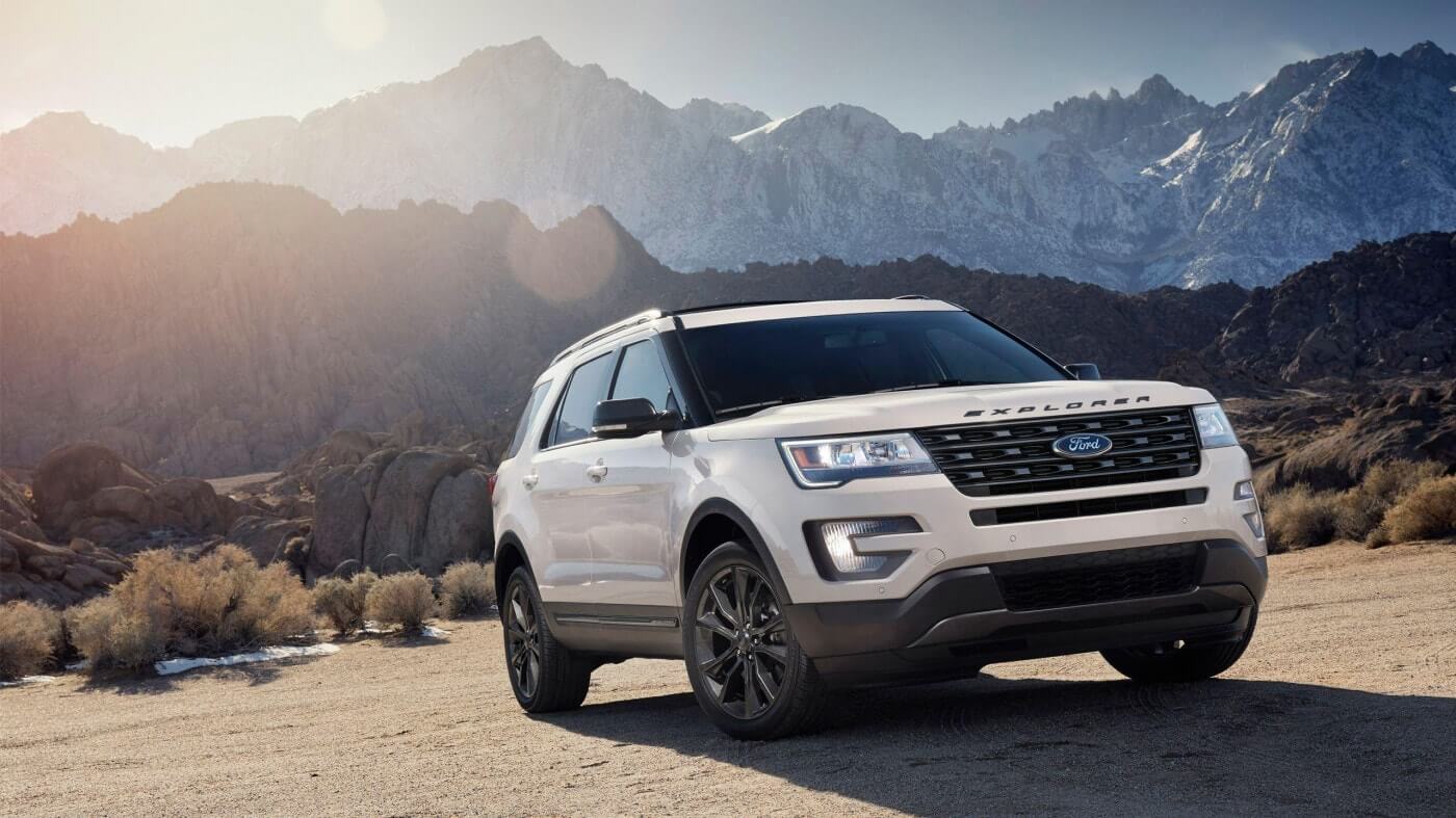 White Ford Explorer, one of the many Ford SUVs.