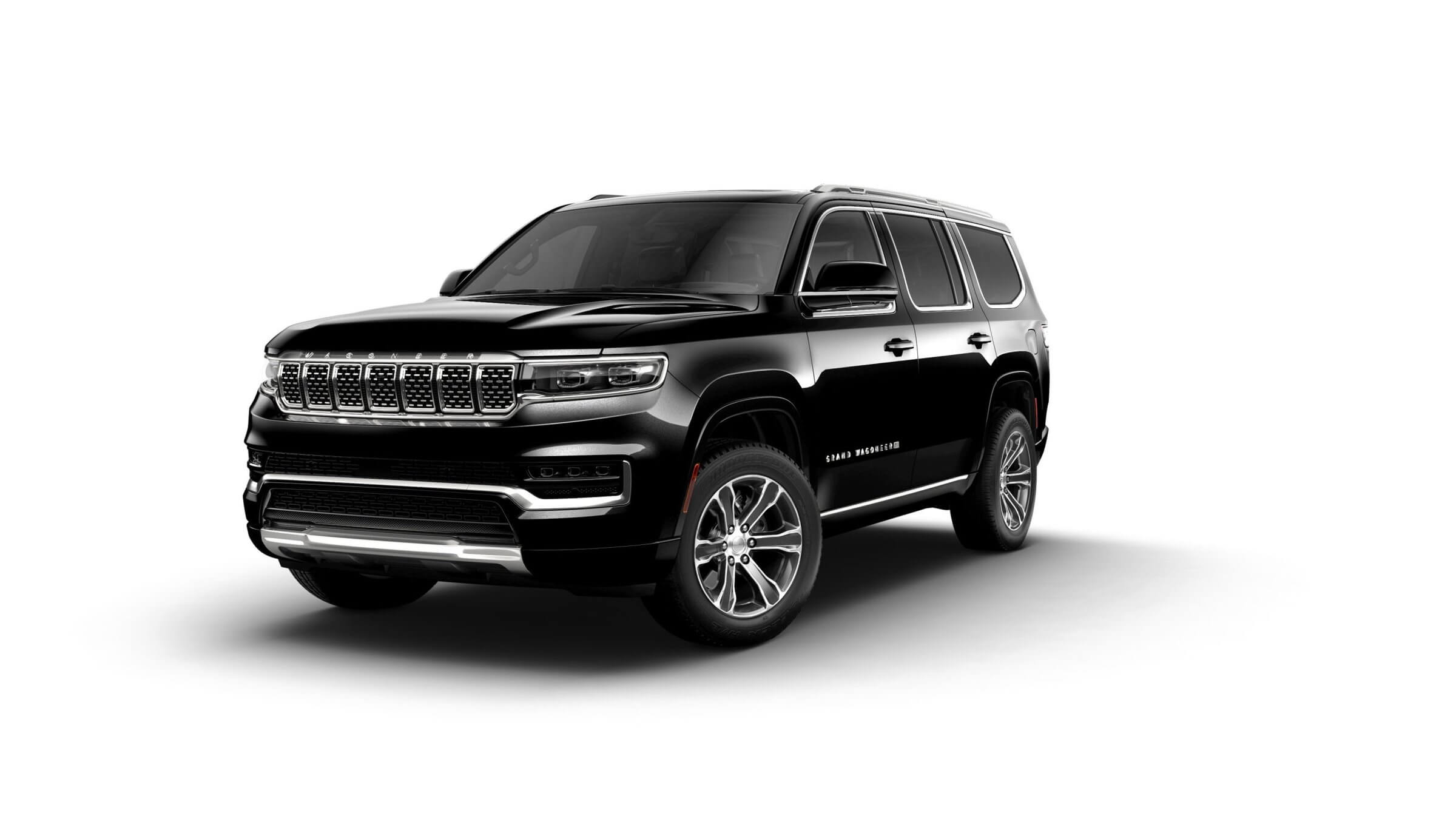 Best SUVs for towing, Black Jeep Grand Wagoneer, with a luxurious interior offering third row seating, towing a maximum weight of 9,750 lbs.