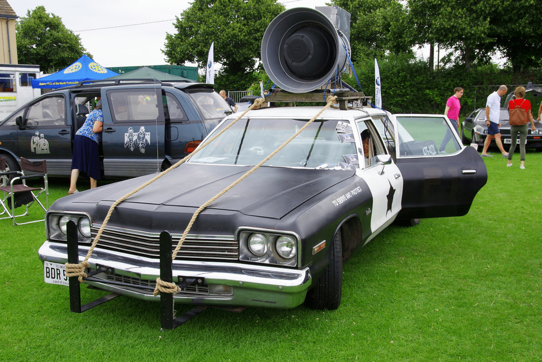 A Bluesmobile replica at a public function.