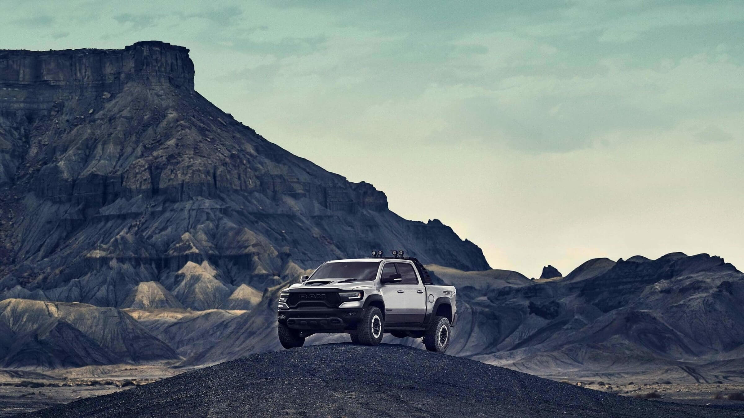 White Ram truck, one of the most reliable trucks on the market today, with crew cab parked in the mountains.