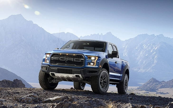 Blue Ford F 150 parked in the mountains, showcasing how good an F 150 looks.