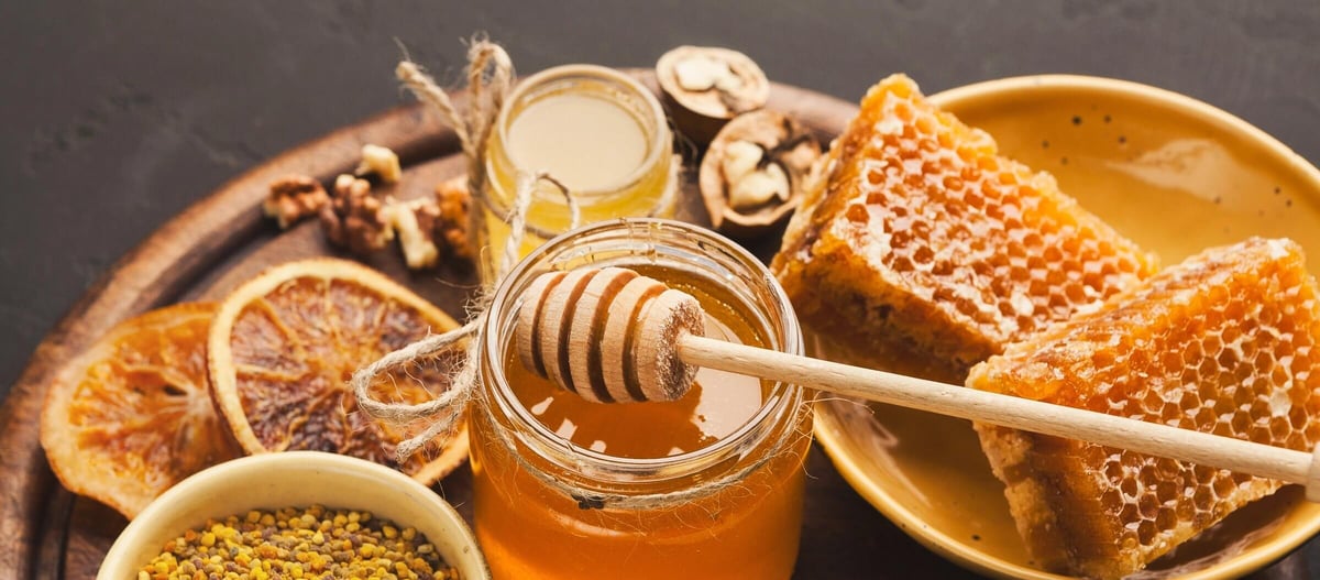 Honey and honeycomb illustrating how honey is made by honey bees