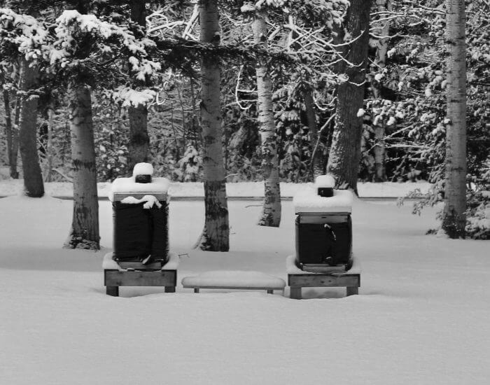 Winter beehive insulation wraps installed around honey bee hives for cold-weather protection