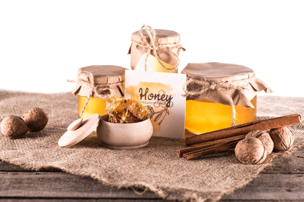 Raw honey and pure honey displayed for comparison