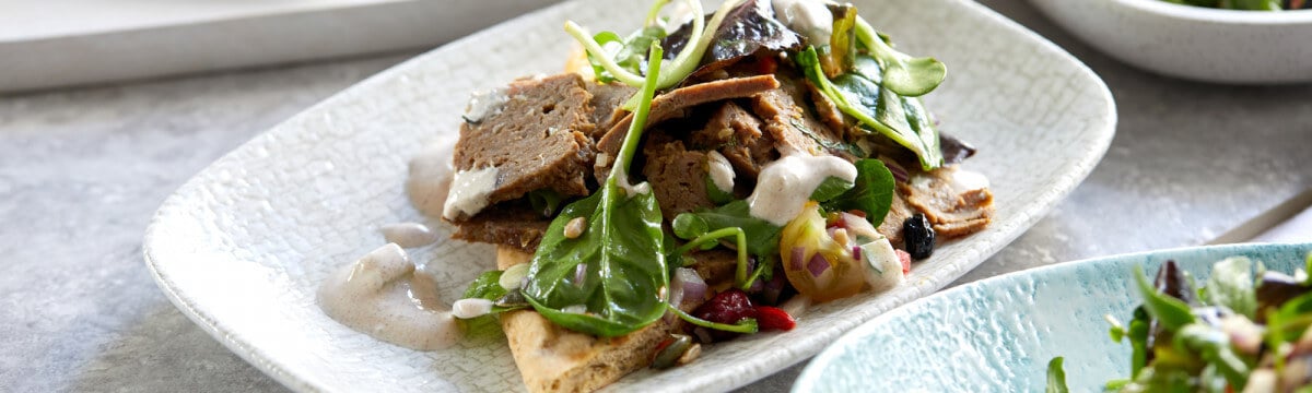 Lamb Kofta pitta bread with cinnamon infused tzatziki, pear and peppermint salad