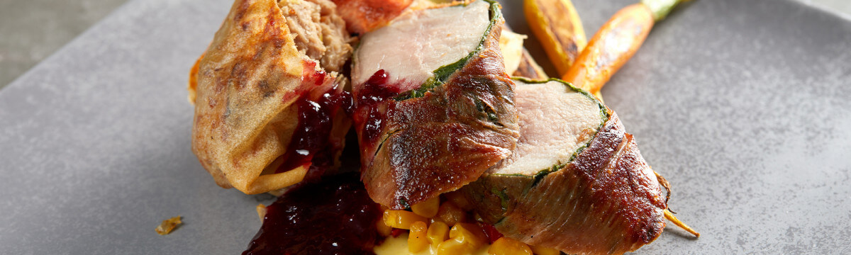 Loin of rabbit with rabbit spring roll, lemon and tomato quinoa salad, sweetcorn puree and sour cherry