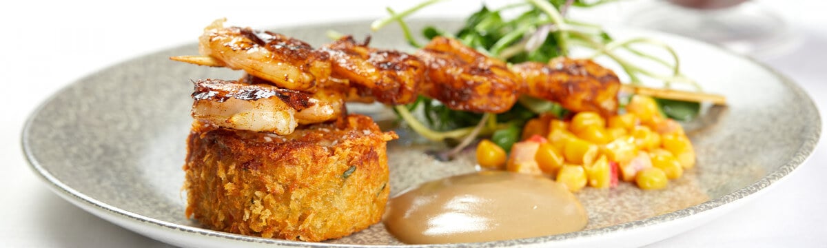 Marinated prawn skewer with a crispy crab cake and a earl grey aioli dip