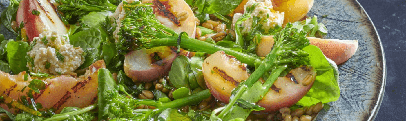 Griddled peach salad with cashew cheese and herb dressing