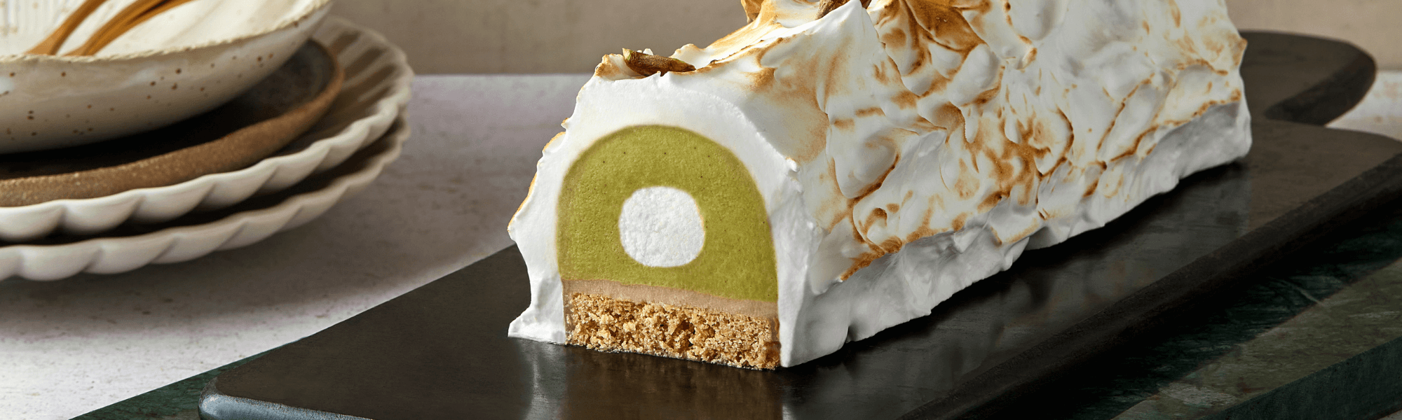 Pistachio and quince log cake